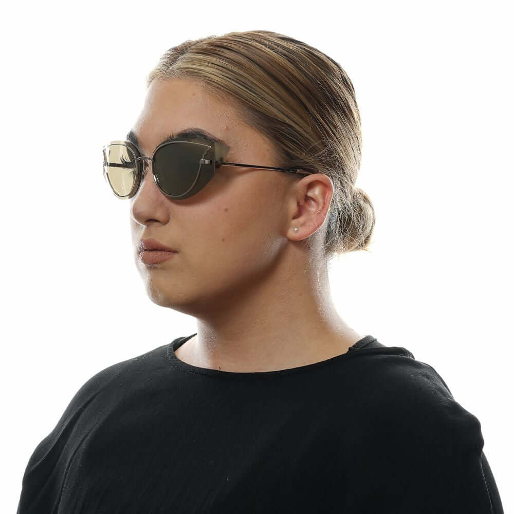 Woman wearing Police Gold Women Sunglasses with gold mirrored cat eye lenses and gold metal frame, 100% UVA/UVB protected.