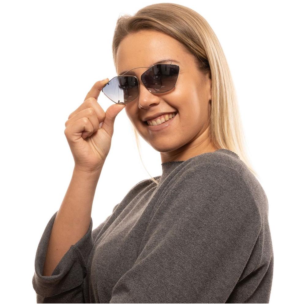 Woman wearing Emilio Pucci silver cat eye sunglasses with blue mirrored lenses.