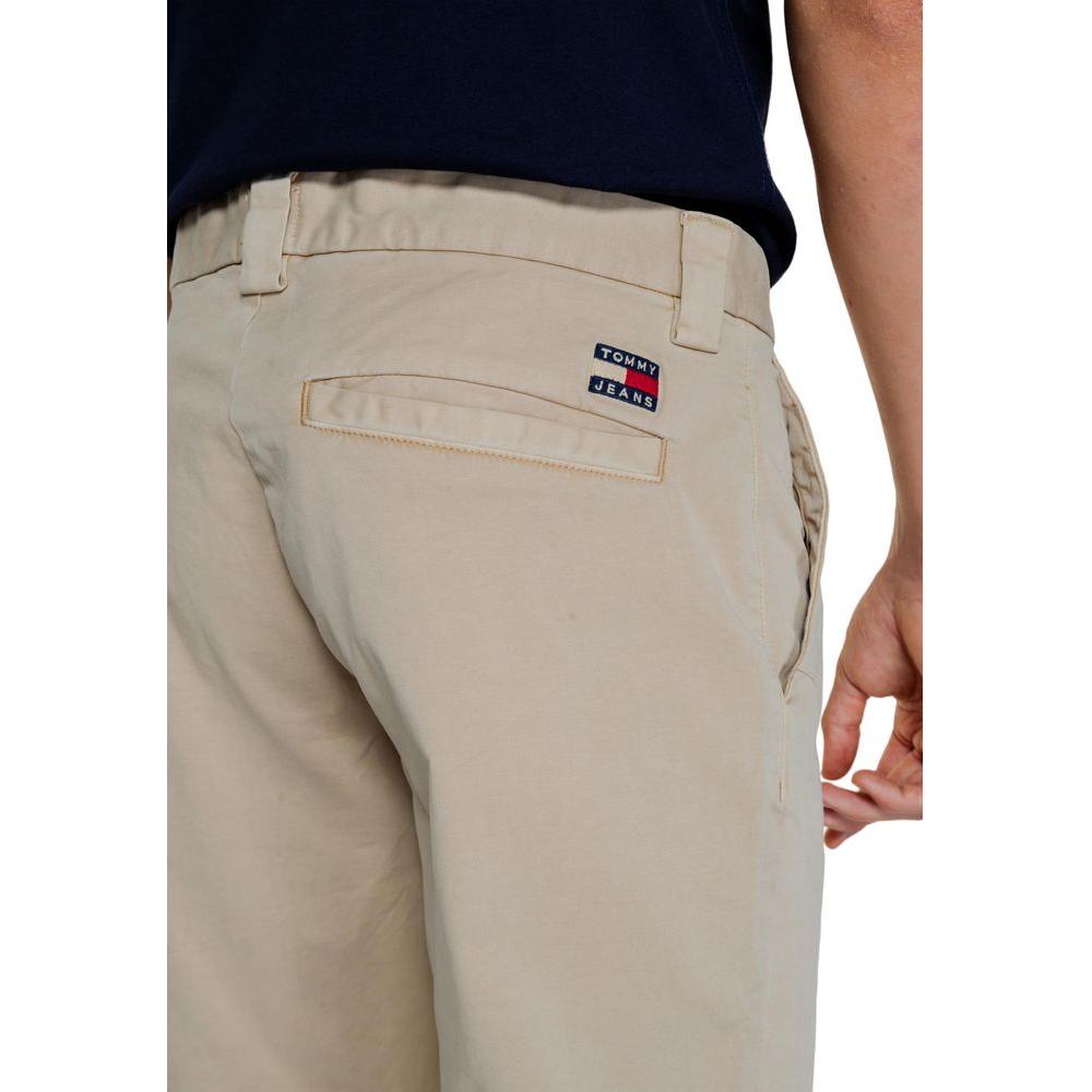 Back view of Tommy Hilfiger men's cotton pants in beige with logo patch, Fall/Winter collection.