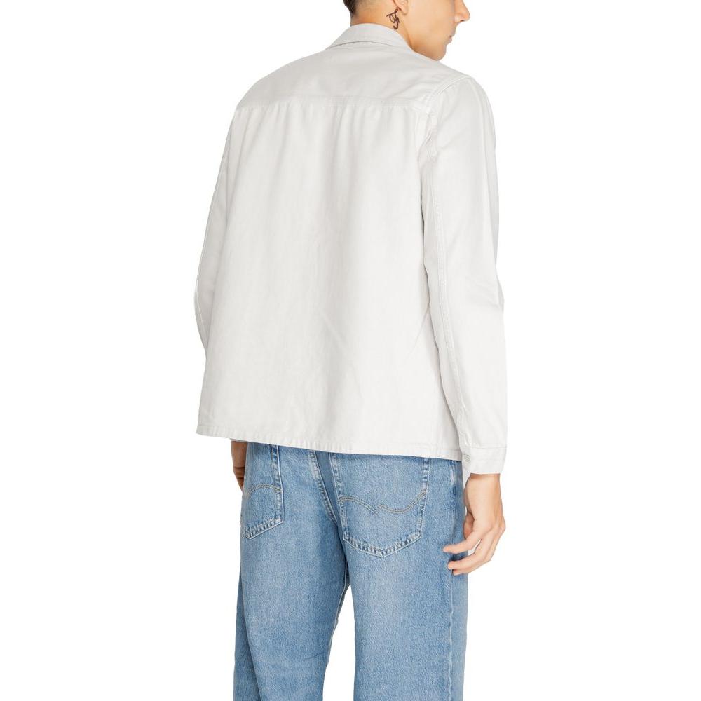Back view of a man wearing an Antony Morato gray cotton shirt from the men's fall/winter collection, paired with blue jeans.
