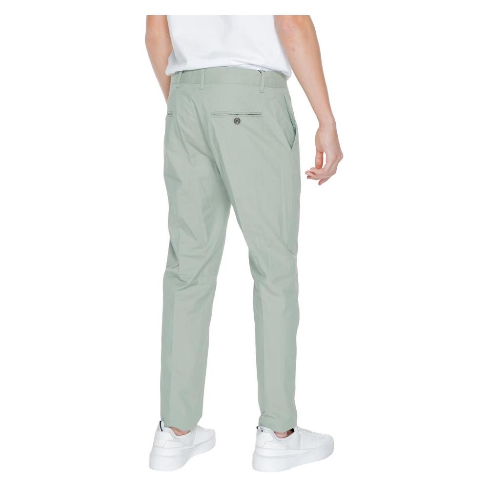 Back view of a person wearing Antony Morato green cotton blend men's suit trousers, part of the spring/summer collection
