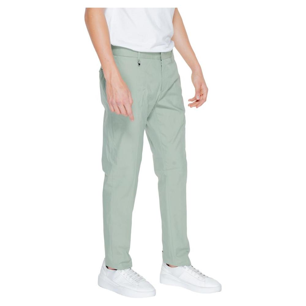 Man wearing Antony Morato green cotton suit trousers, part of the spring/summer collection, showcasing a relaxed fit and casual style.