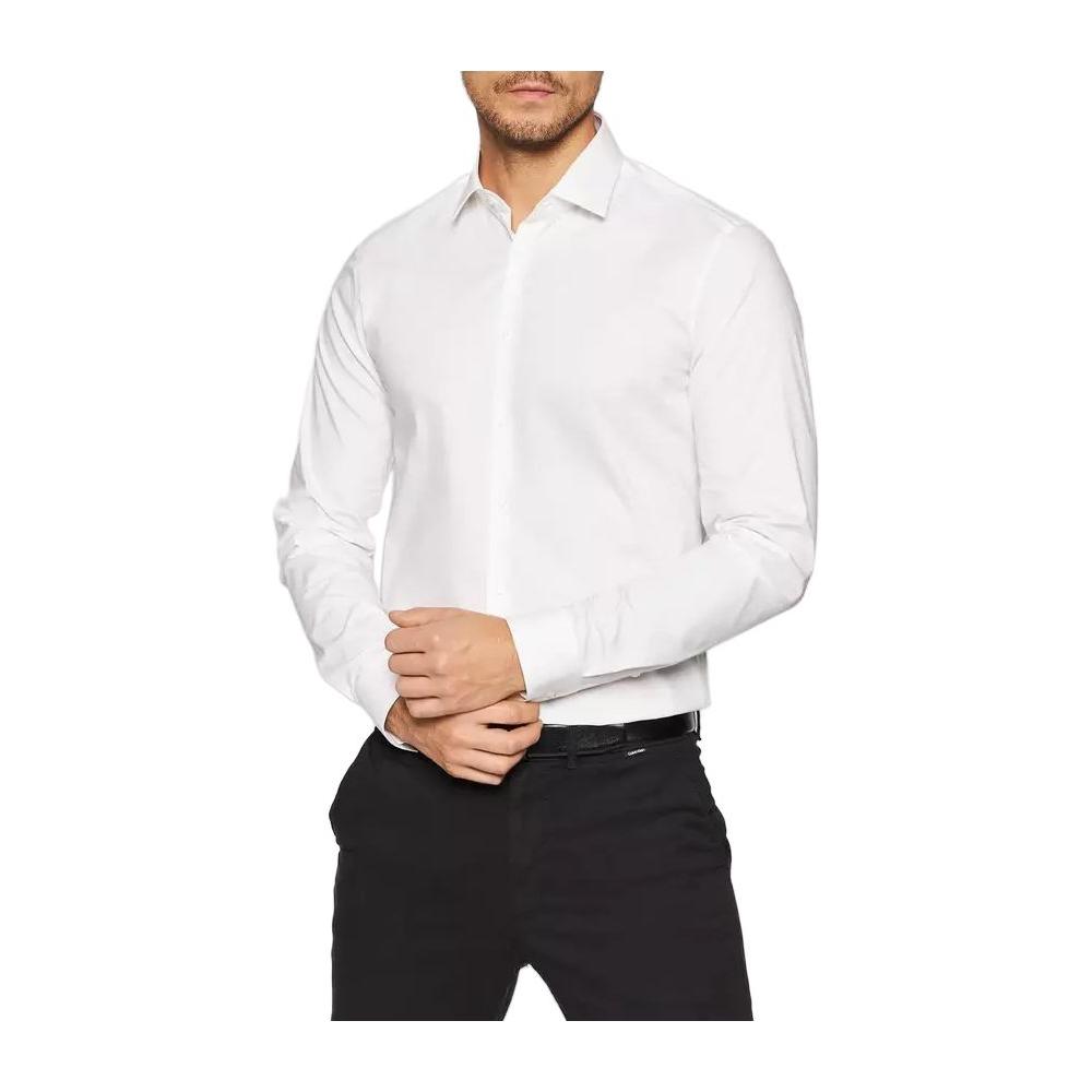 Man wearing Calvin Klein white cotton long-sleeve shirt, slim fit.