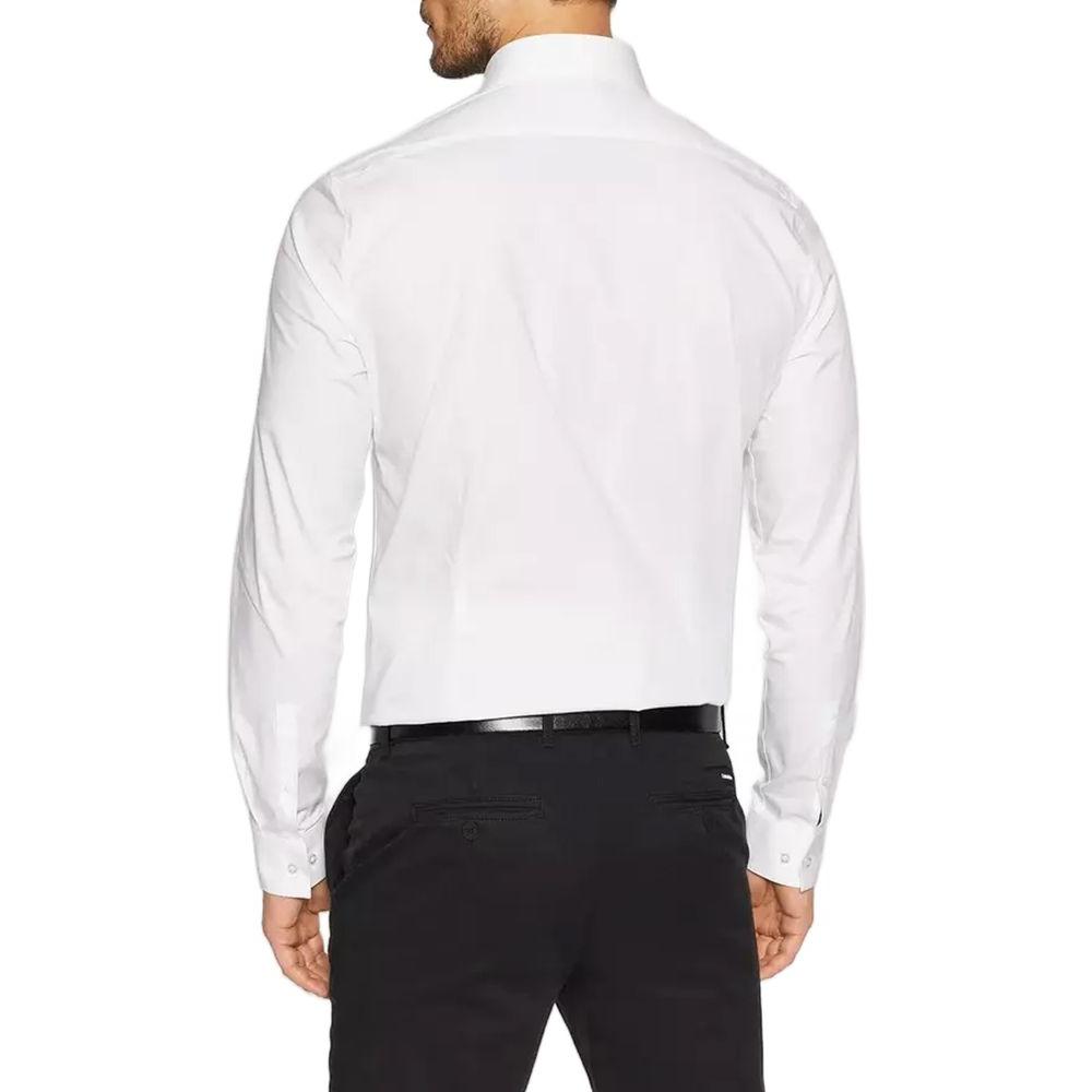 Back view of Calvin Klein K10K108229 men's white cotton shirt, showing slim fit design paired with black dress pants for a chic look.