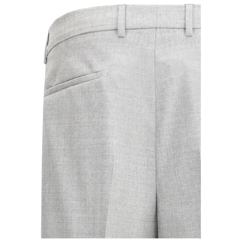Brunello Cucinelli virgin wool pants with belt loops, side slash pockets, and back welt pocket detail in light grey fabric.