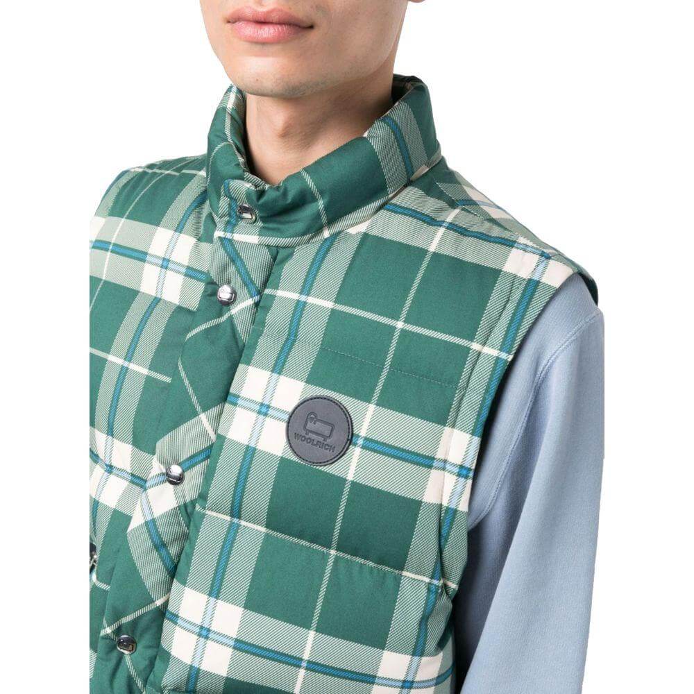 Woolrich green checkered polyester vest with goose down padding, button and zip closure, and front pockets on a model.
