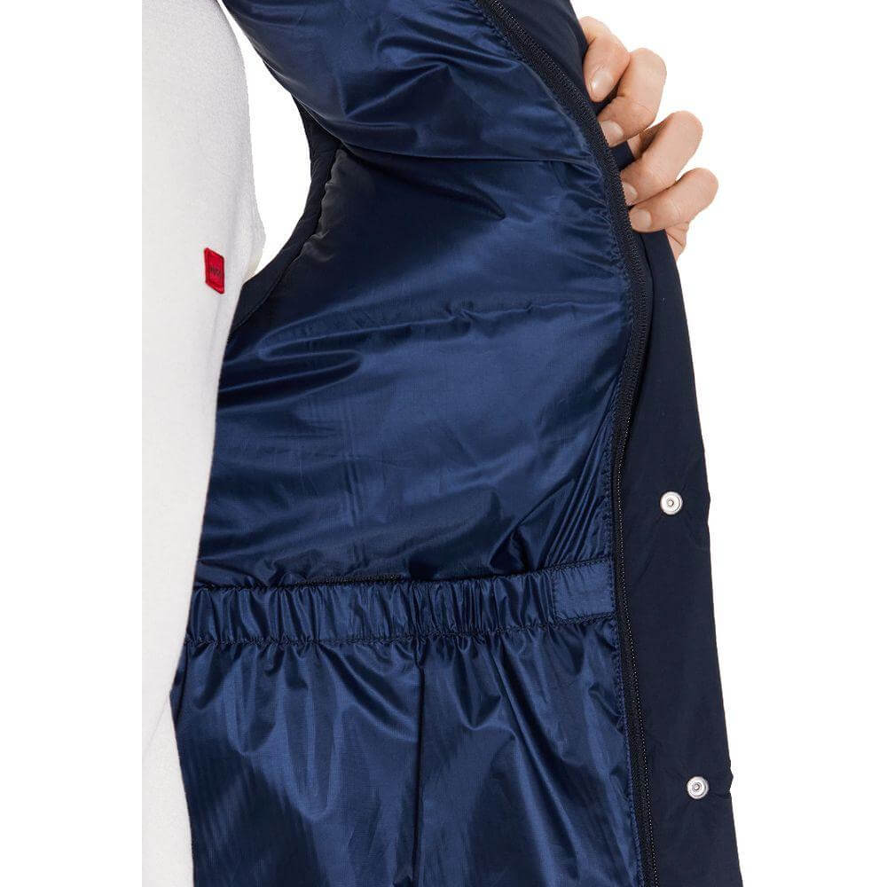 Interior view of Woolrich blue polyester vest with technical fabric, featuring button and zip fastening and goose down padding.