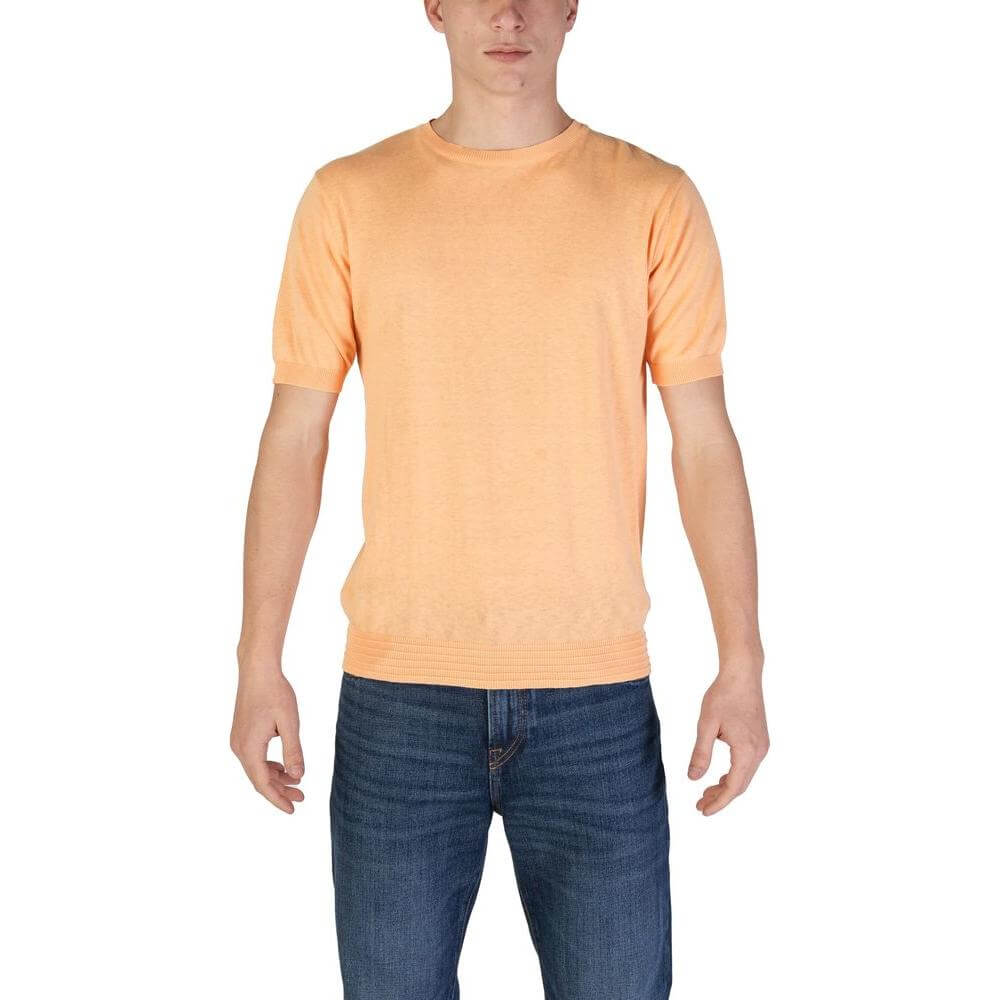 Man wearing Hamaki-Ho orange cotton T-shirt from fall/winter collection, 100% cotton, perfect for casual wear