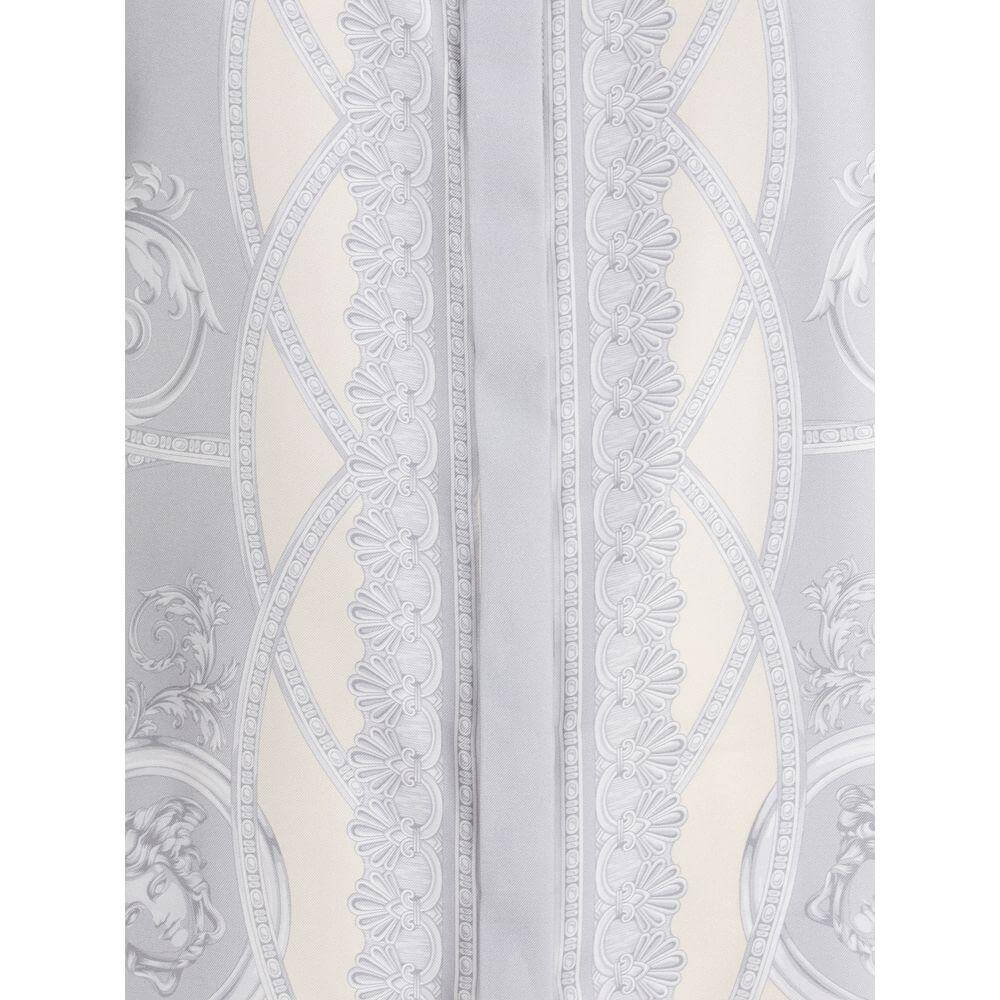 Detailed view of Versace Barocco shirt fabric showcasing elegant opulent motifs and golden accents.