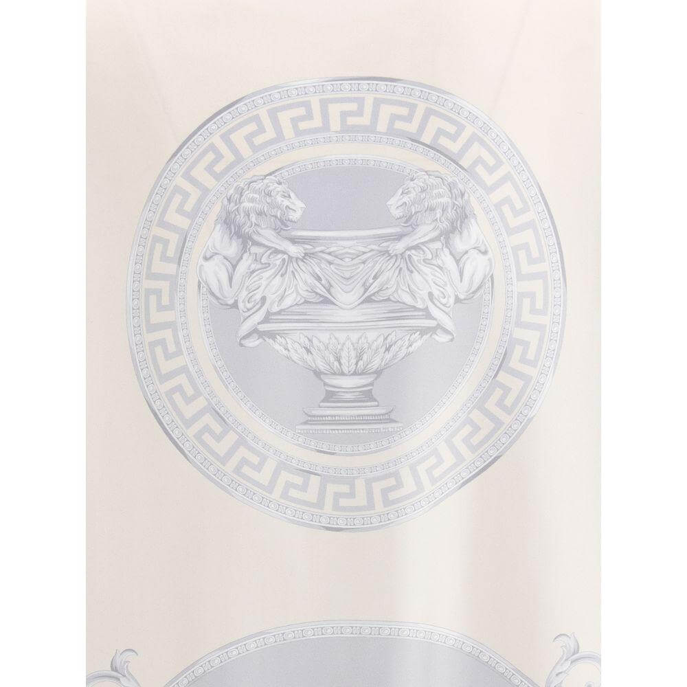 Versace Barocco pattern featuring elegant grey motifs and intricate lion details on a silk shirt, highlighting luxury and style.