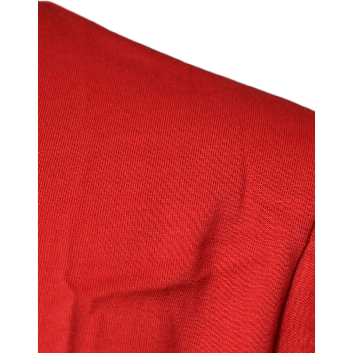 Close-up of red Dolce & Gabbana cotton fabric, showcasing texture and color of DG logo crew neck t-shirt.