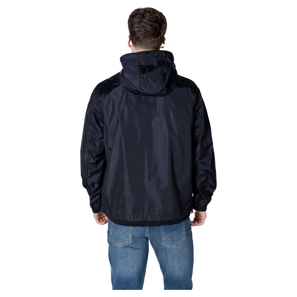 Back view of a man wearing an Armani Exchange blue polyamide jacket, featuring a hood, suitable for men's casual wear.
