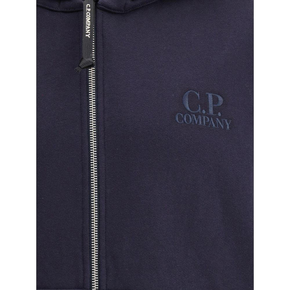C.P. Company navy cotton hoodie with front zipper, adjustable drawstring hood, welt pockets, and tone-on-tone embroidered logo.