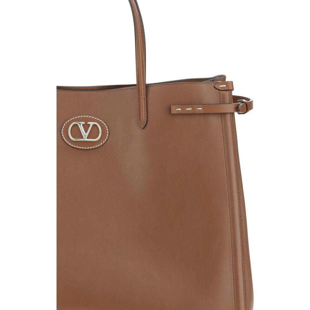 Valentino Garavani Large Antibes Tote Bag in leather with VLogo metallic element and double handles.