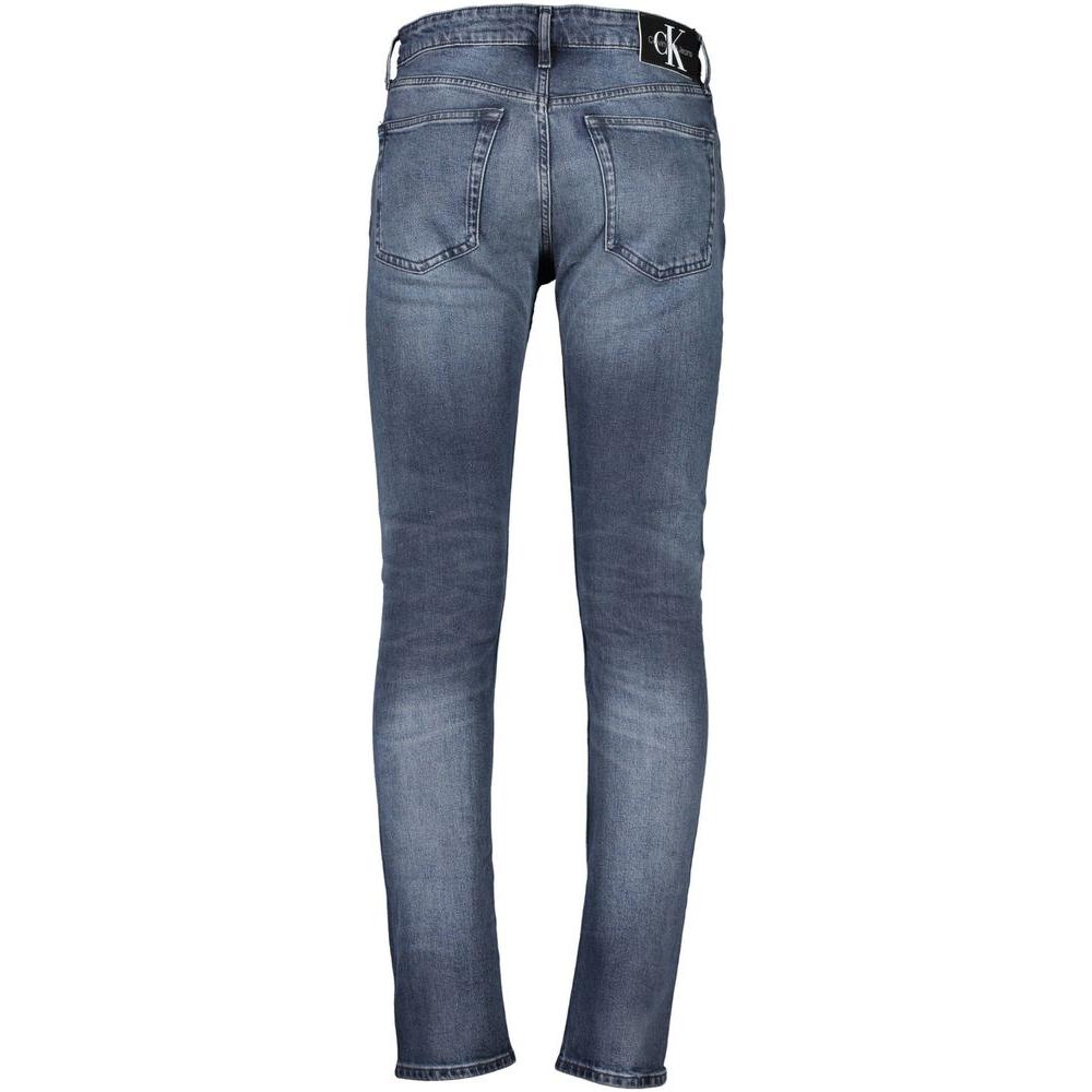 Calvin Klein blue cotton jeans with washed effect, featuring 5 pockets and logo on waistband, rear view.