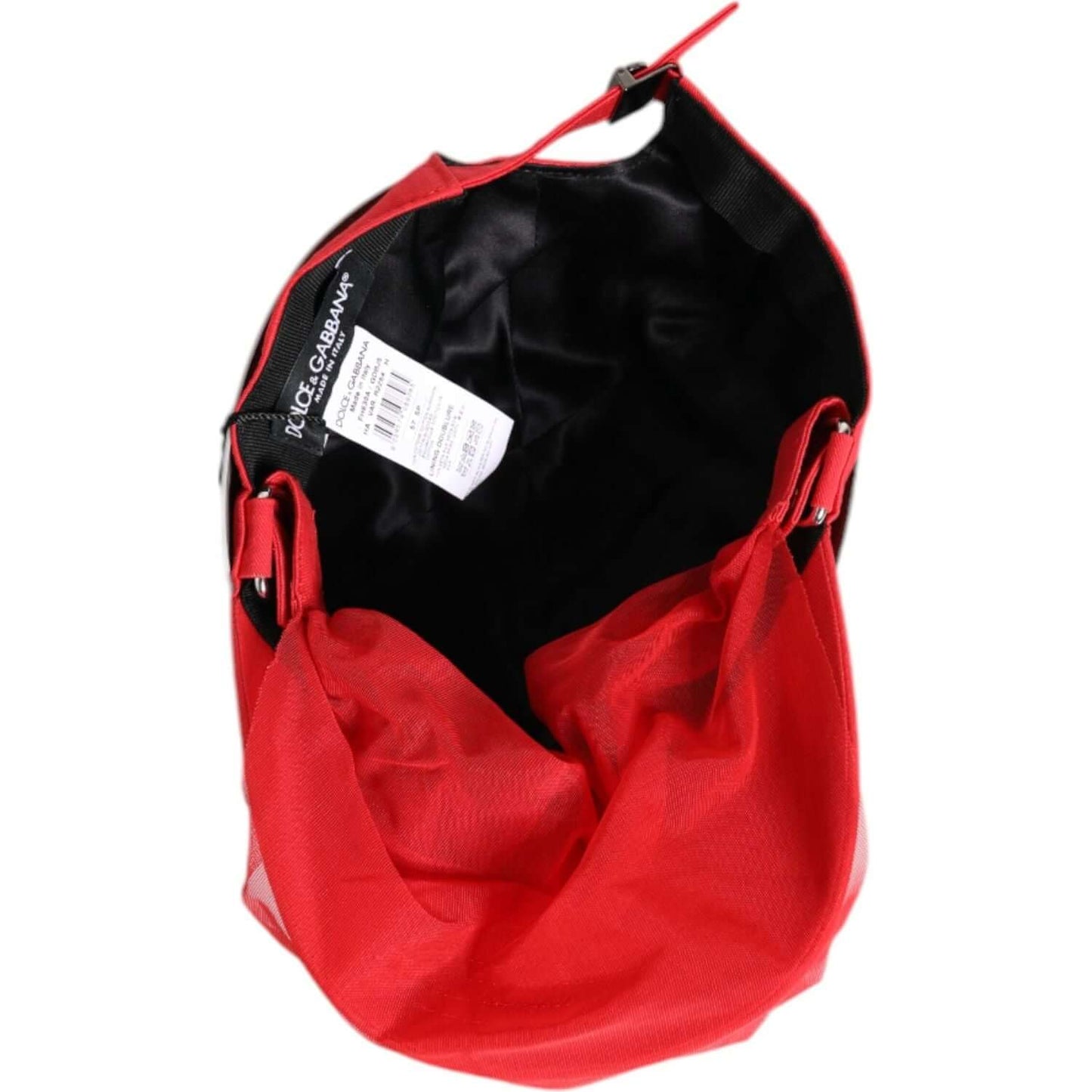 Interior view of Dolce & Gabbana red cotton women's baseball cap showing tags and silk lining.
