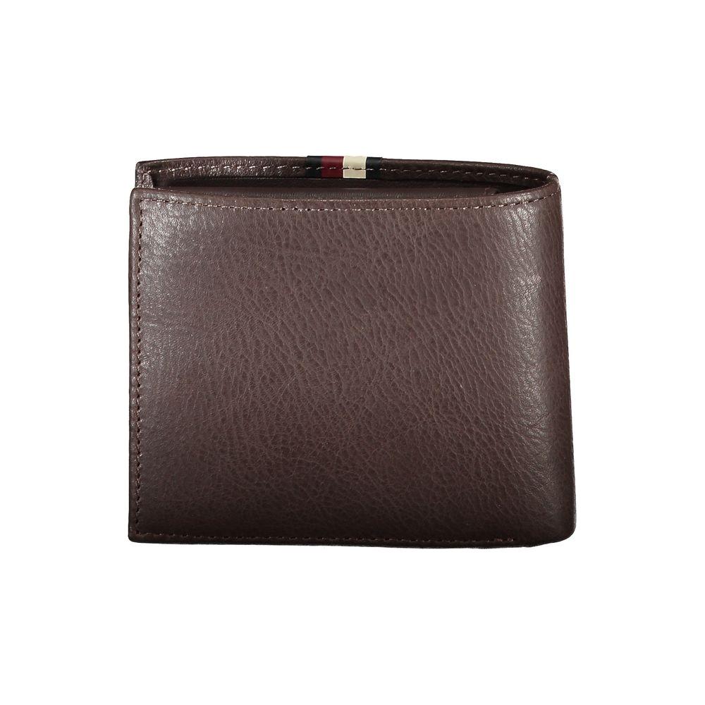 Tommy Hilfiger brown leather men's wallet with contrast detail, featuring two compartments, coin purse, and double card spaces.