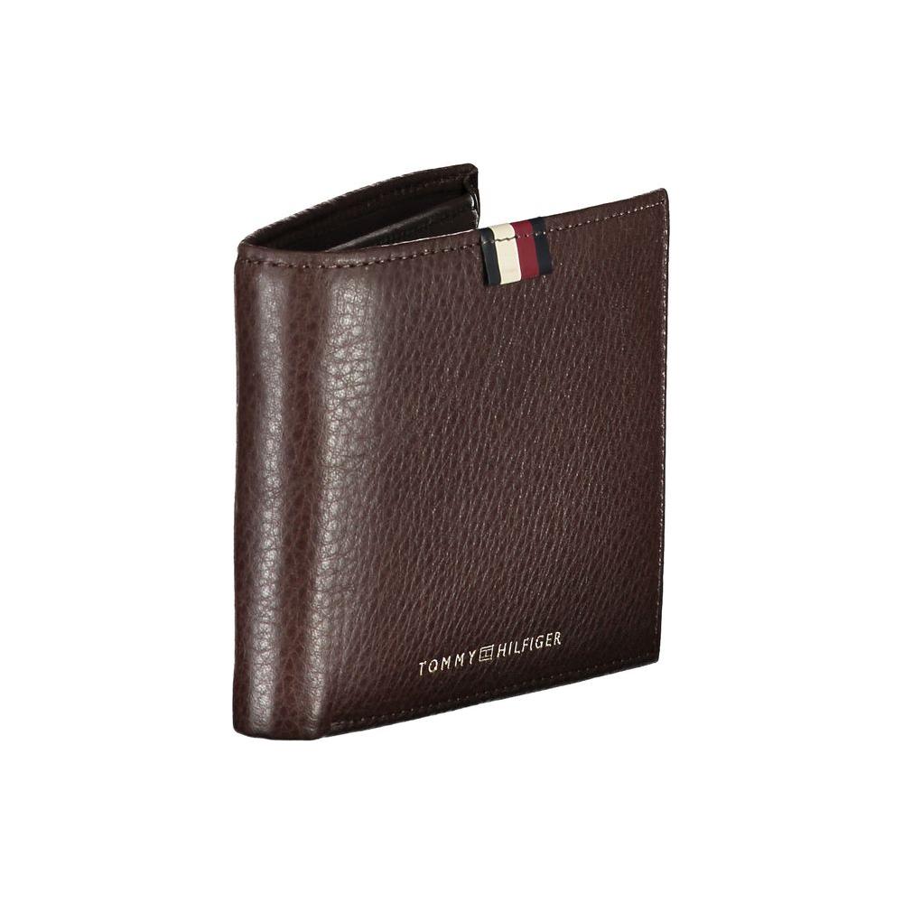 Tommy Hilfiger brown leather men's wallet with logo, featuring dual compartments and card slots for sophisticated style.