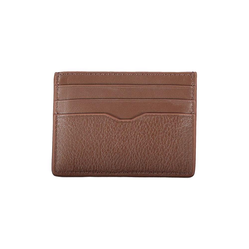 Tommy Hilfiger sleek brown leather card holder with contrast detailing and embossed logo, featuring central pocket for secure card storage.