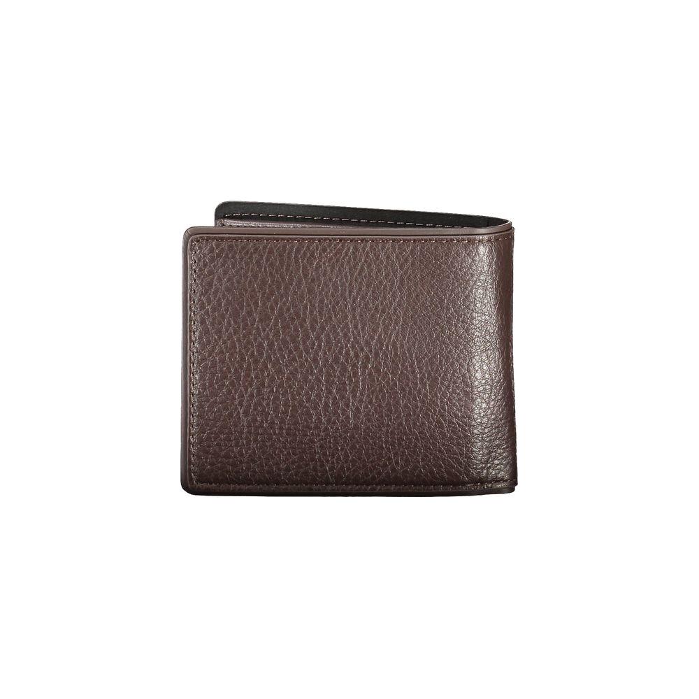 Tommy Hilfiger brown leather wallet with 2 compartments, coin purse, card spaces, contrasting details, and logo print.