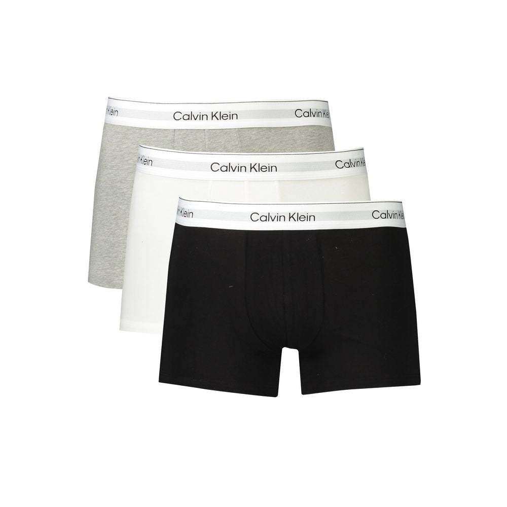 Calvin Klein cotton men's boxer trio in black, grey, and white with logo waistband for comfort and style.