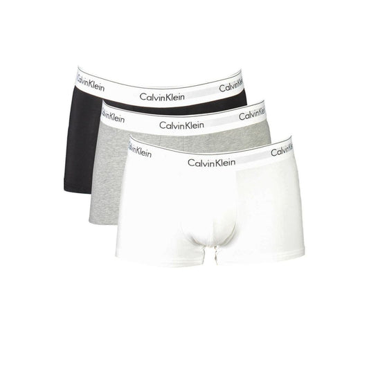 Calvin Klein tri-pack boxer shorts in black, grey, and white with logo waistband, made from sustainable cotton blend for comfort.