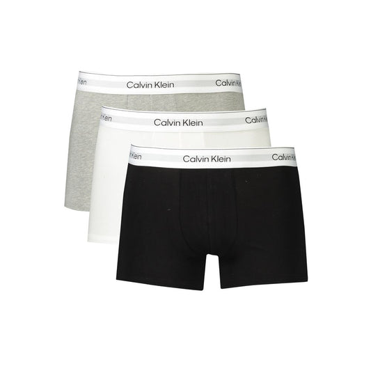 Calvin Klein cotton men's boxer trio in black, grey, and white with logo waistband for comfort and style.